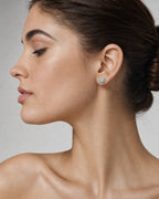 Female model wearing 14K Heart Halo Diamond Earrings