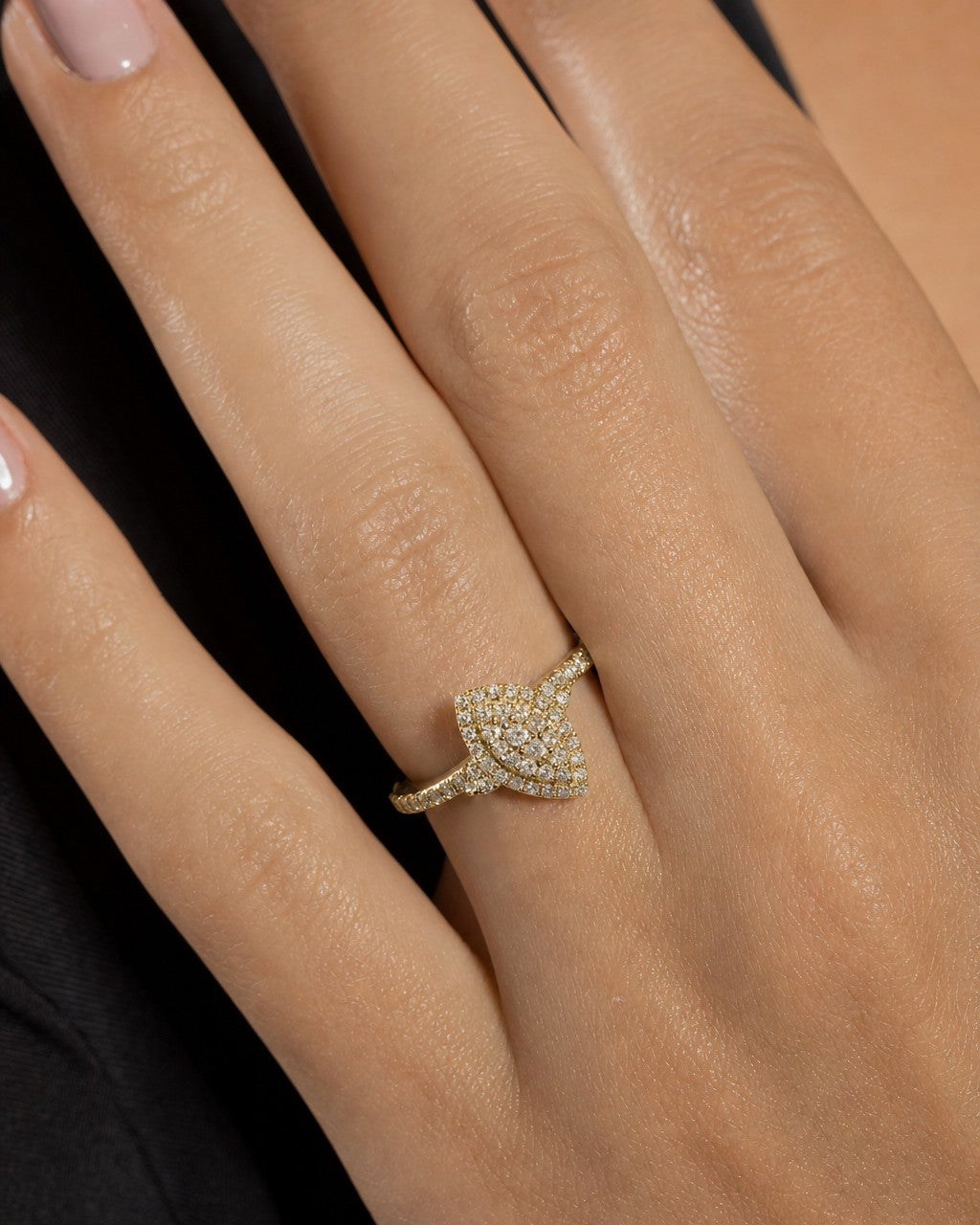 Female model wearing 14K Yellow Gold Marquise Cut Diamond Engagement Ring