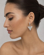 Female model wearing 14K Hanging Pyramid Triangle Dangling Diamond Earrings