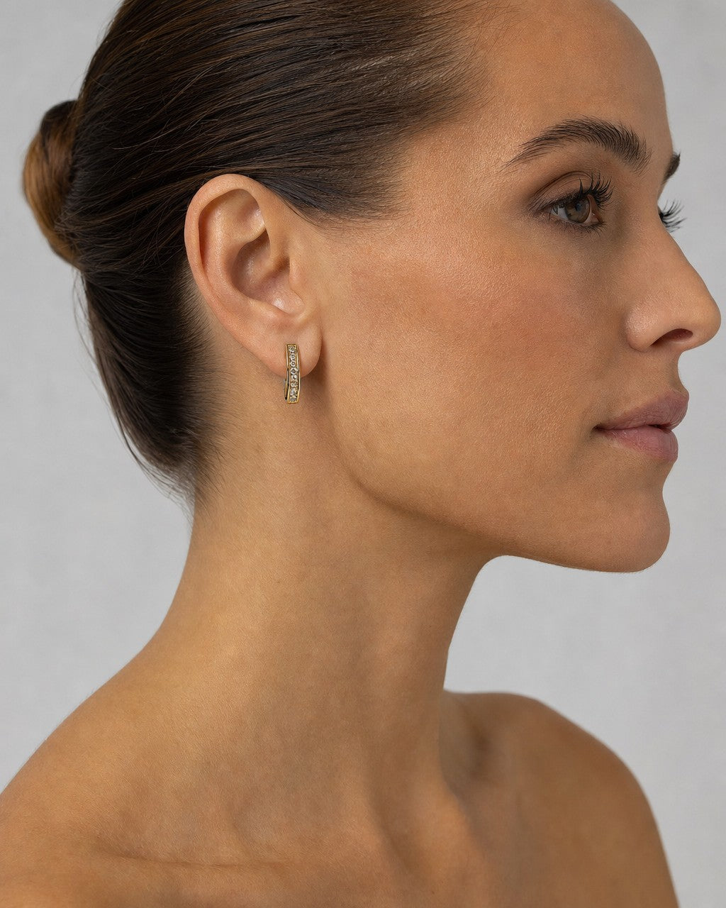 Female model wearing 14K Circle Hoop Diamond Earrings