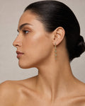 Female model wearing 14K Hanging 3-Tier Triangles Dangling Diamond Earrings