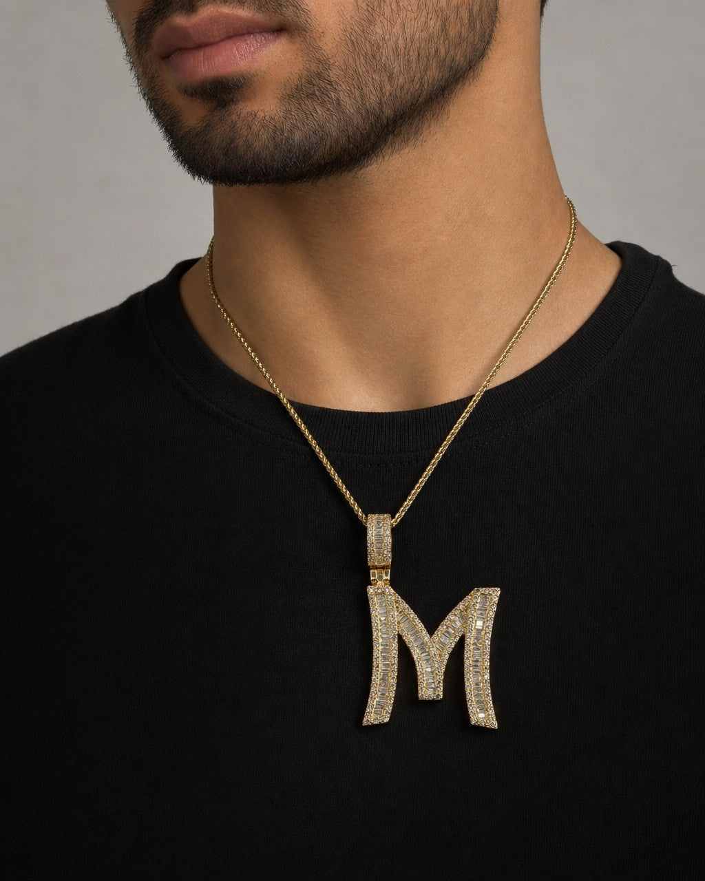 Male model wearing 14K Initial M Diamond Baguette Pendant