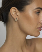 Female model wearing 14K Cat Stud Diamond Earrings