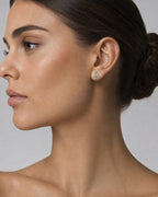 Female model wearing 14K Triangle Equilateral Diamond Baguette Earrings