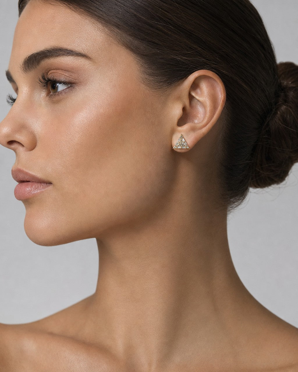 Female model wearing 14K Triangle Equilateral Diamond Baguette Earrings