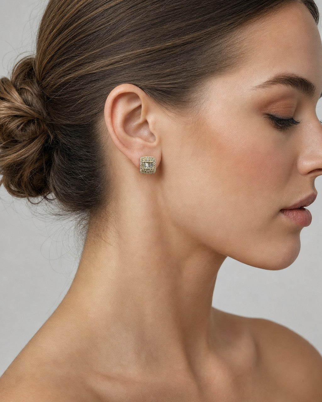 Female model wearing 14K Jumbo Rectangle Halo Diamond Baguette Earrings