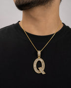 Male model wearing 14K Initial Q Diamond Baguette Pendant