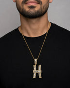 Male model wearing 14K Initial H Diamond Baguette Pendant