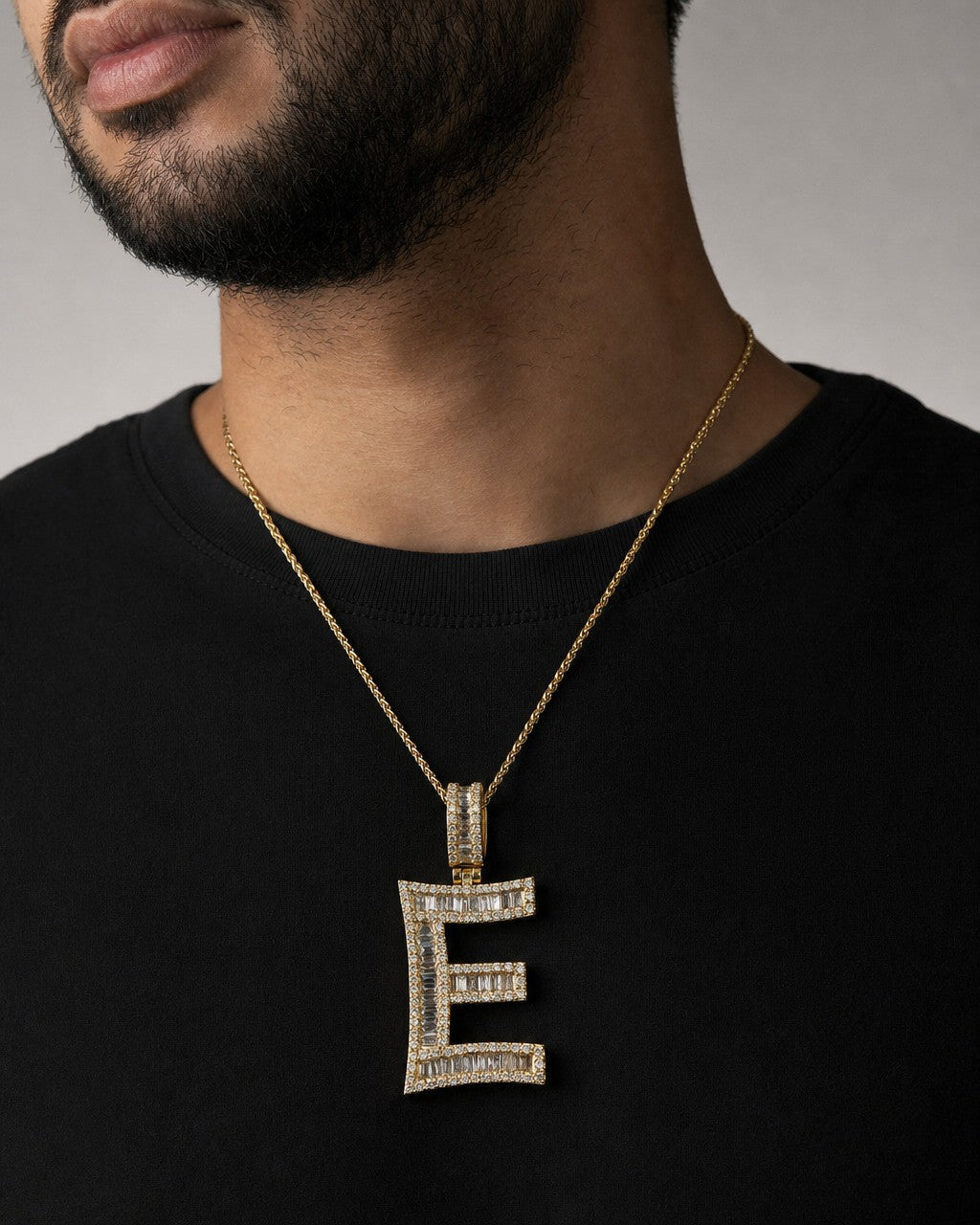 Male model wearing 14K Initial E Diamond Baguette Pendant