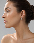 Female model wearing 14K Large Tear Shape Diamond Baguette Earrings