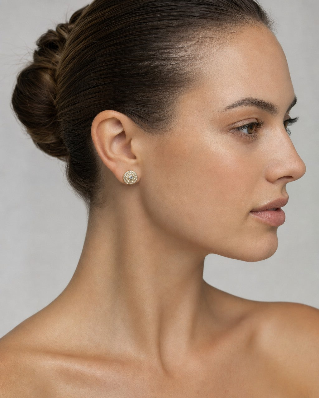 Female model wearing 14K Small Circle Cake Diamond Earrings