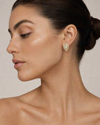 Female model wearing 14K Pear Shaped Halo Diamond Earrings