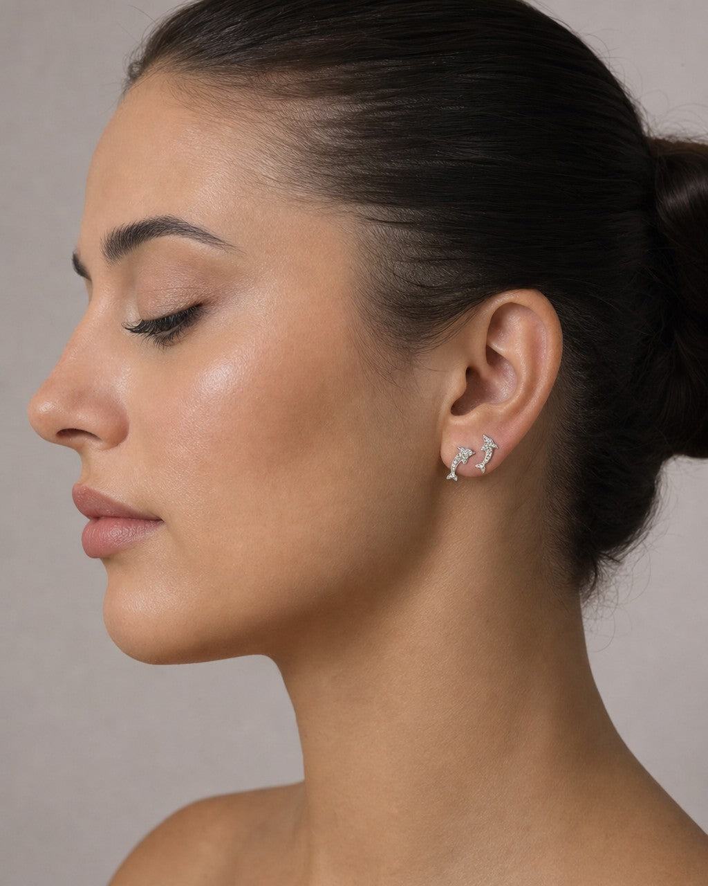 Female model wearing 14K Dolphin Diamond Earrings