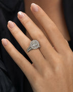 Female model wearing 14K Halo Circle with Large Center Stone Diamond Ring