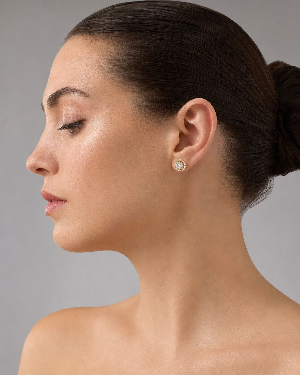 Female model wearing 14K Circle Halo Diamond Earrings