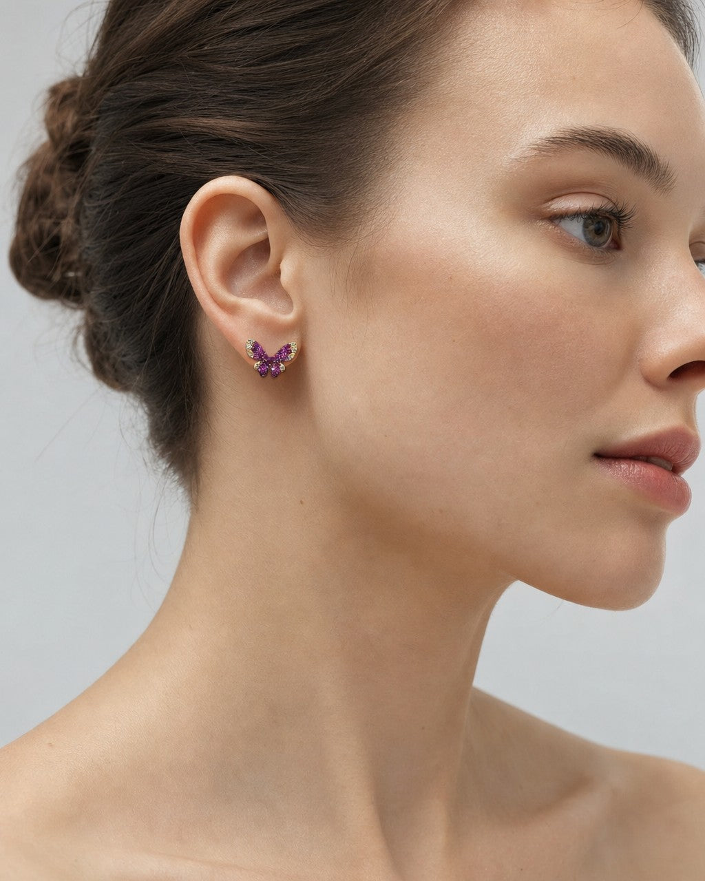 Female model wearing 14K Purple Butterfly Diamond Earrings