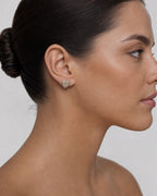 Female model wearing 14K Halo Heart Diamond Earrings