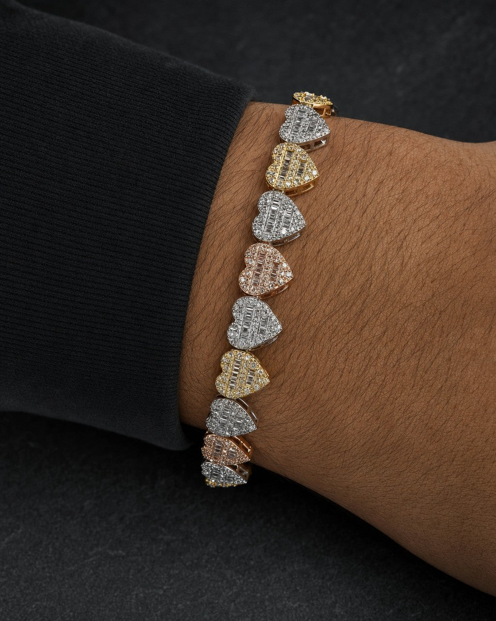 Male model wearing 10K 9MM Multi-Color Hearts Link Diamond Baguette Bracelet 6.5-7.5