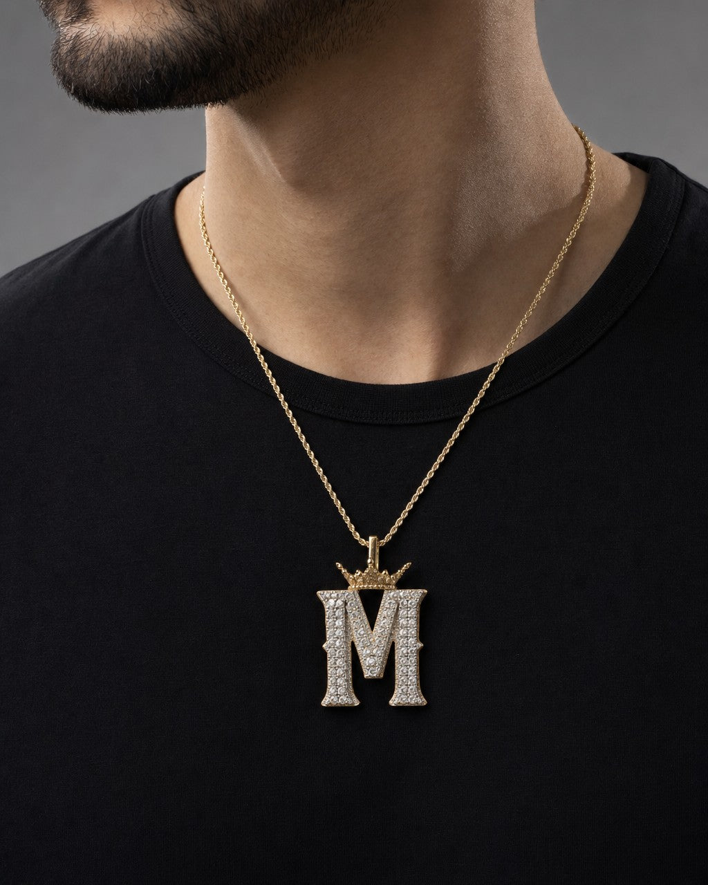 Male model wearing 10K Popular Crown Initial Pendant