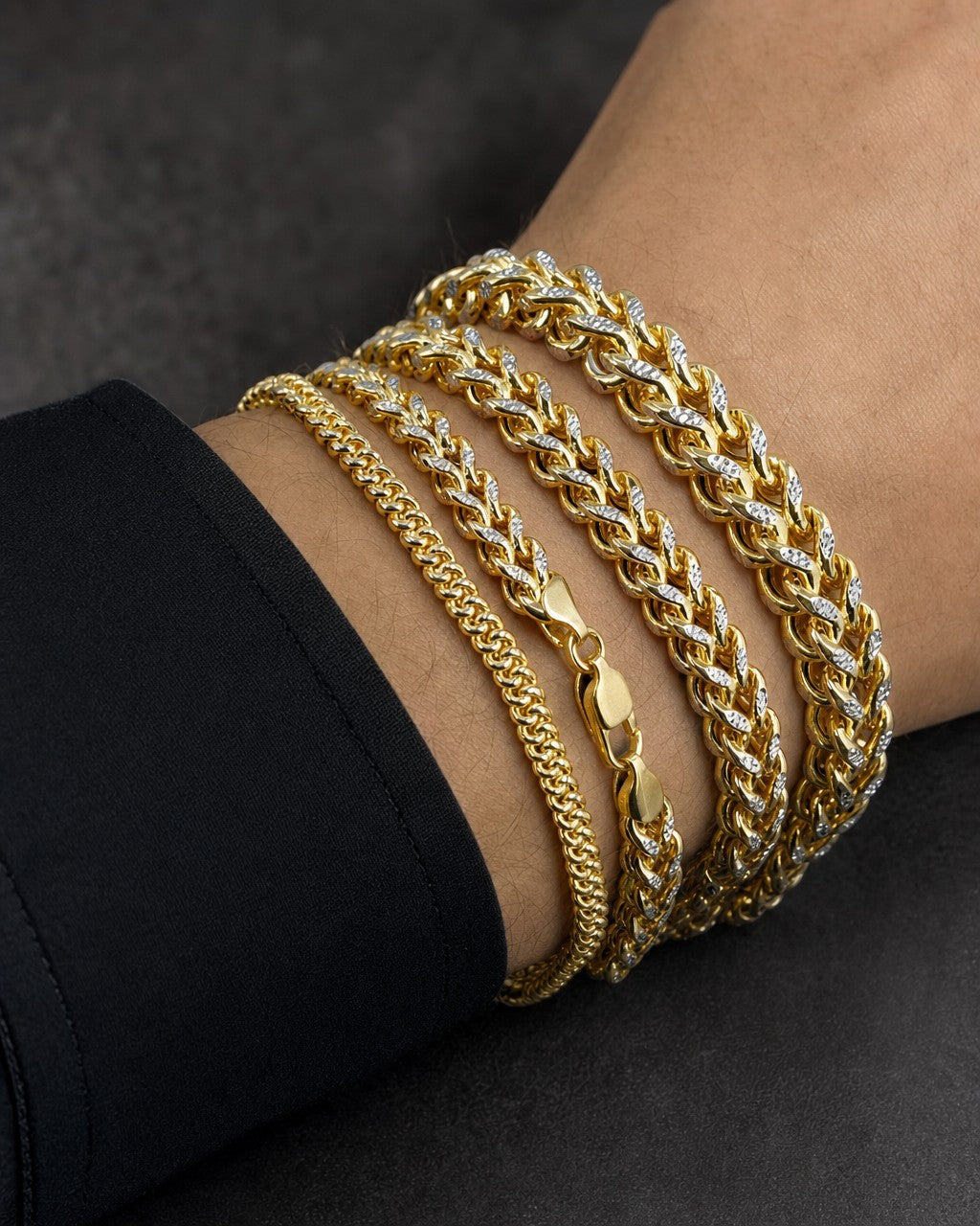 Male model wearing 10K Two-Tone Box Chain Bracelet