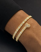 Male model wearing 10K/14K Heart Diamond Baguette Bangle Bracelet