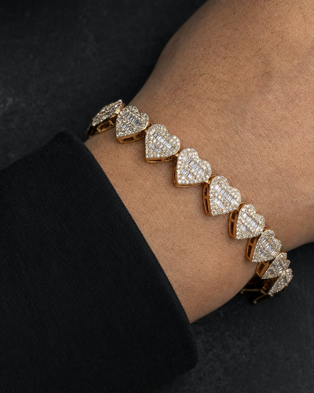 Male model wearing 14K 9MM Hearts Link Diamond Baguette Bracelet 6.5-7.5"