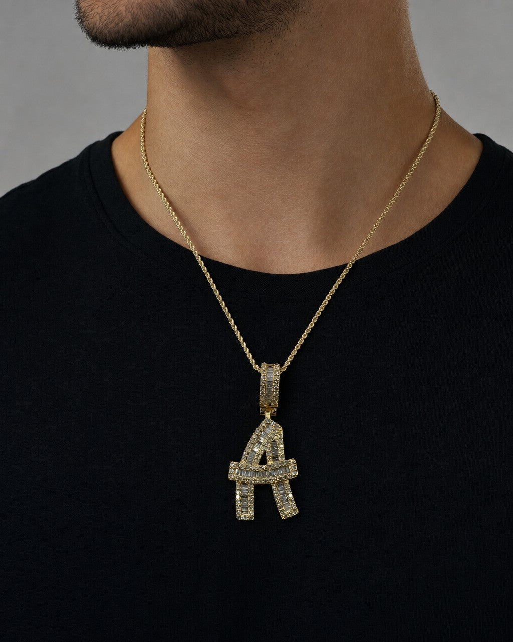 Male model wearing 14K Bamboo Initial Letter Diamond Baguette Pendants Full Collection