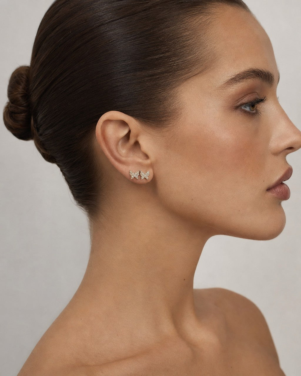 Female model wearing 14K Butterfly Diamond Earrings