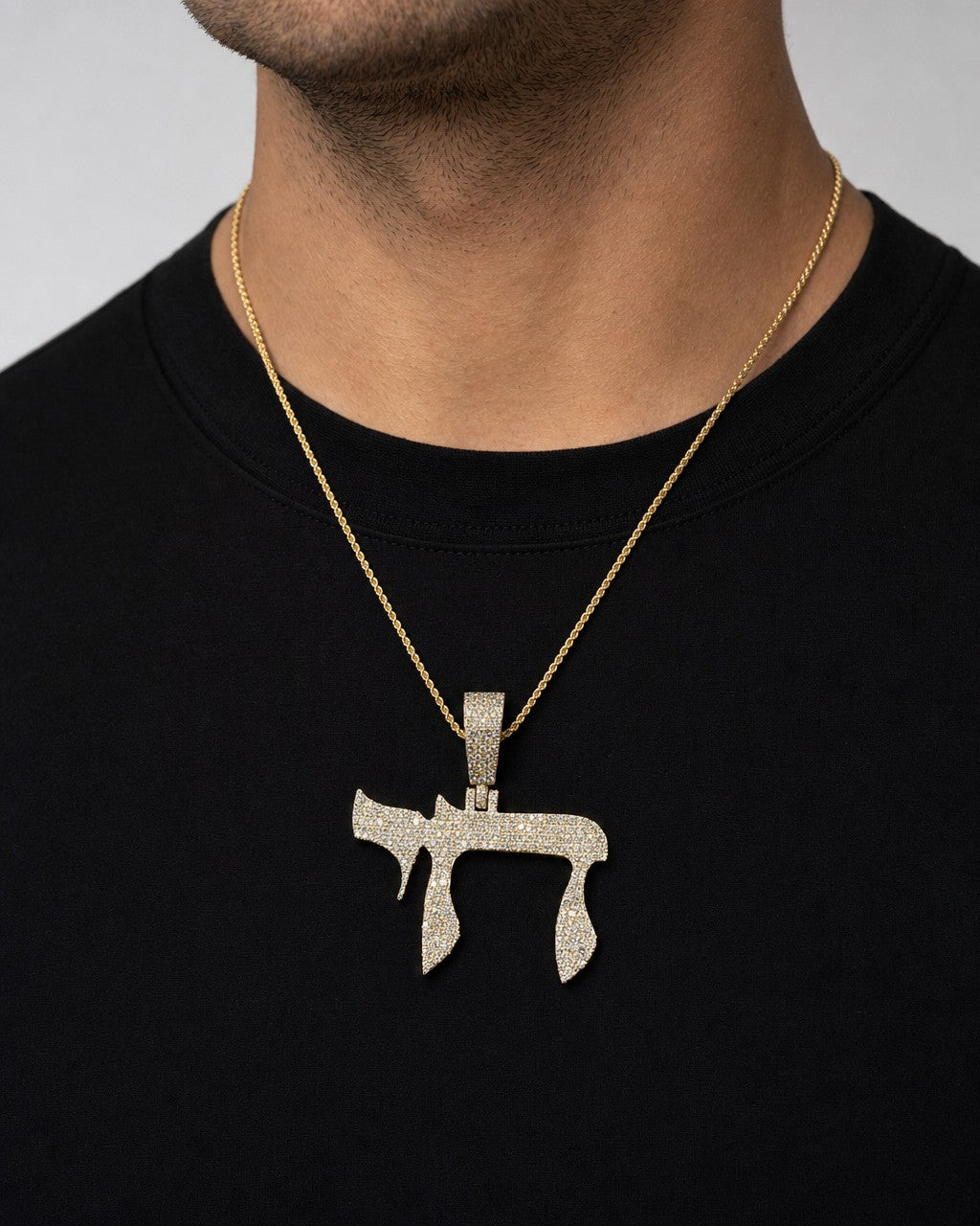 Male model wearing 14K Chai Diamond Pendant