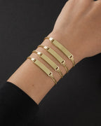 Male model wearing 14K Custom Name Plate Baby Bracelet