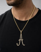 Male model wearing 14K Jumbo Script Initial Letter Diamond Pendants Full Collection