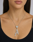 Female model wearing 14K Script Initial Letter Heart Diamond Pendants Full Collection