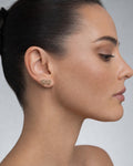 Female model wearing 14K Square Gutter Diamond Baguette Earrings