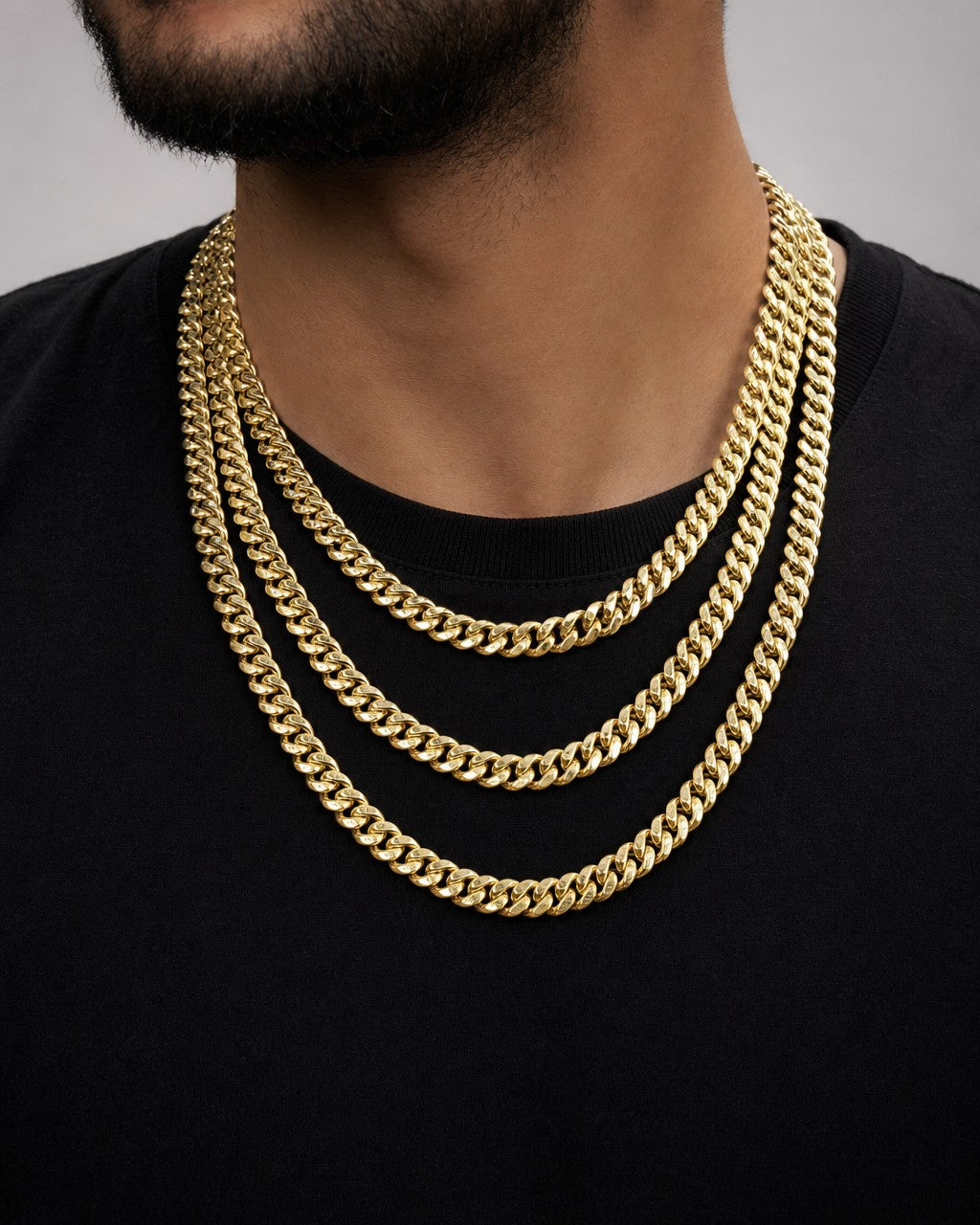 Male model wearing 14K Gold 9MM Miami Cuban Link Chain